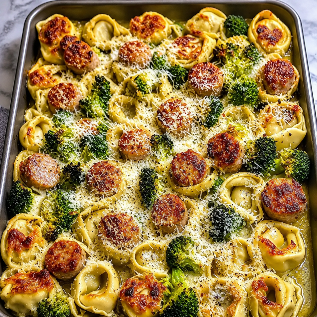 Roasted broccoli, sausage, and tortellini combined in a bowl