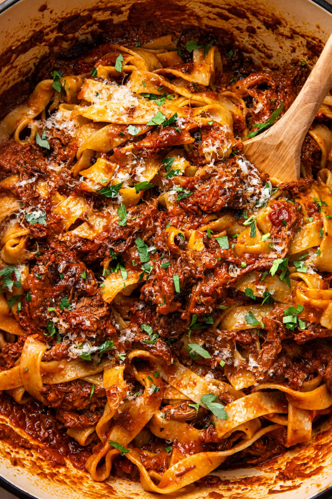 Short ribs braising in wine and tomato sauce