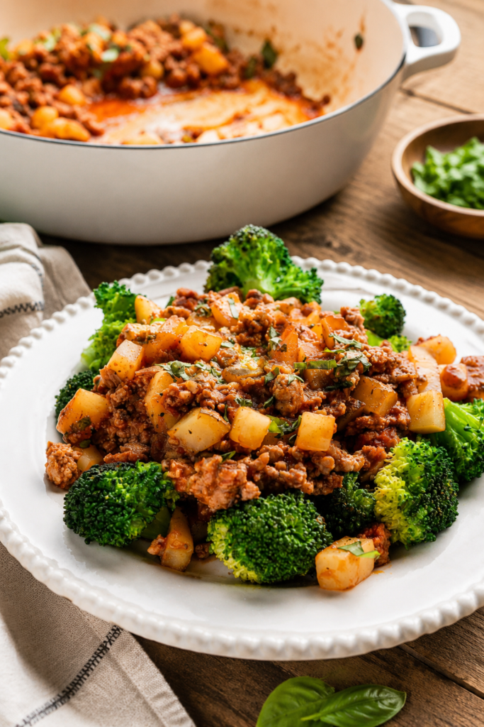 Hearty ground turkey and potatoes skillet garnished with herbs