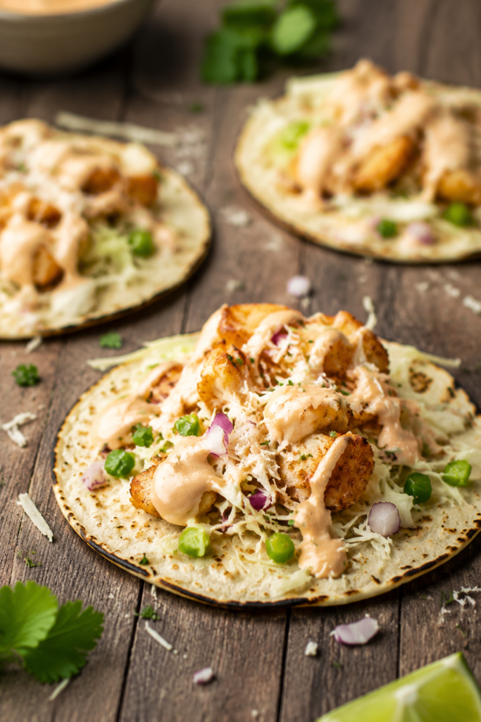 Corn tortillas warming in a dry skillet
