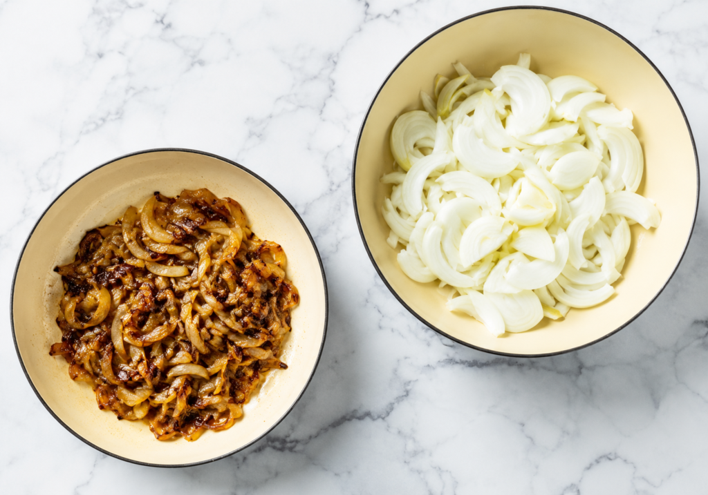 Sliced onions caramelizing slowly in a skillet