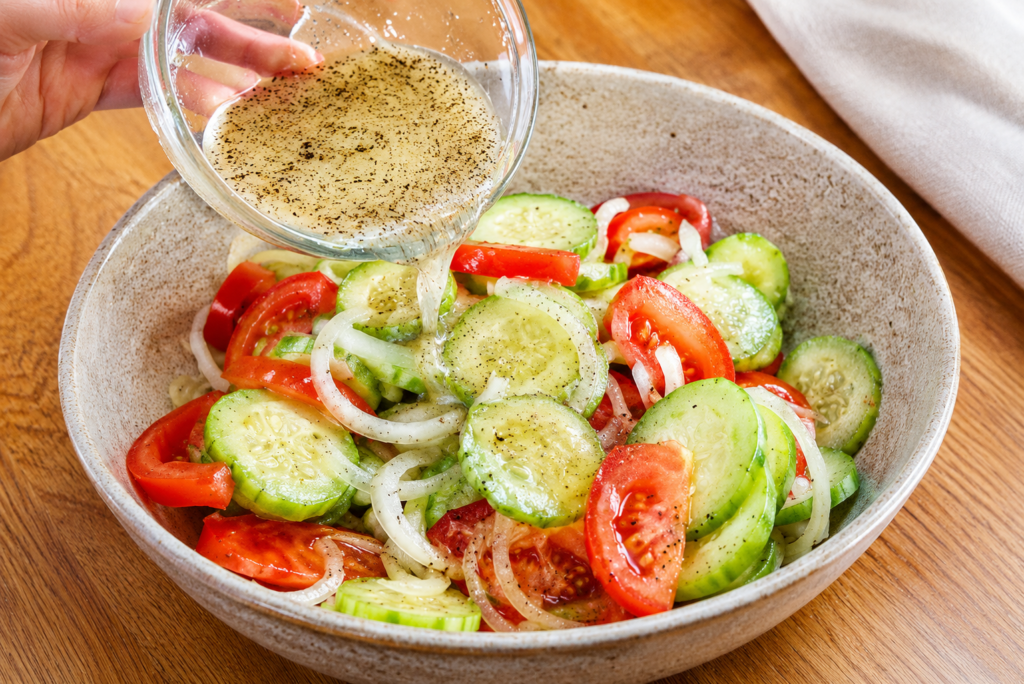 Marinated cucumbers, onions, and tomatoes garnished with dill