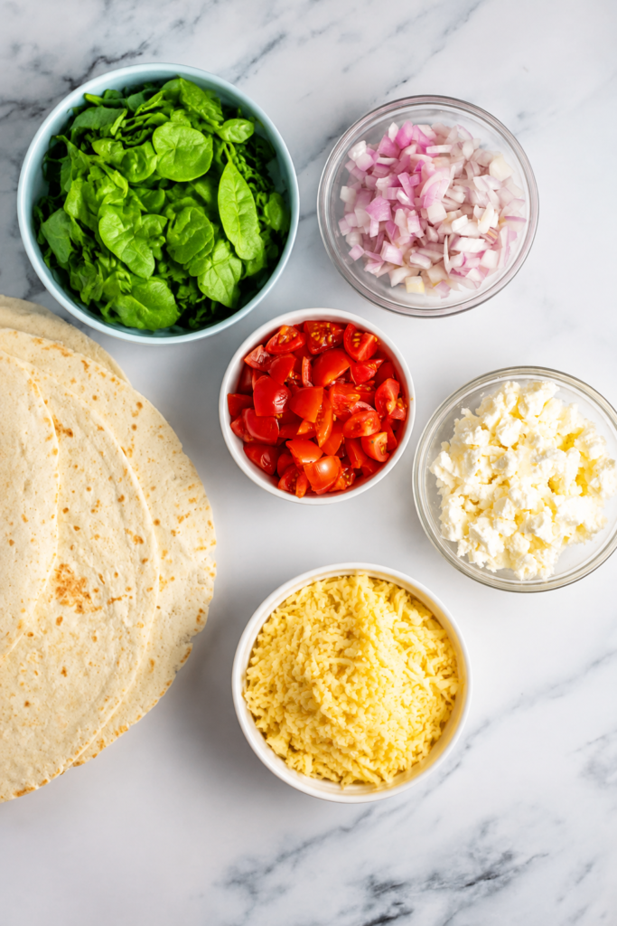 Tortilla folded over Mediterranean quesadilla filling