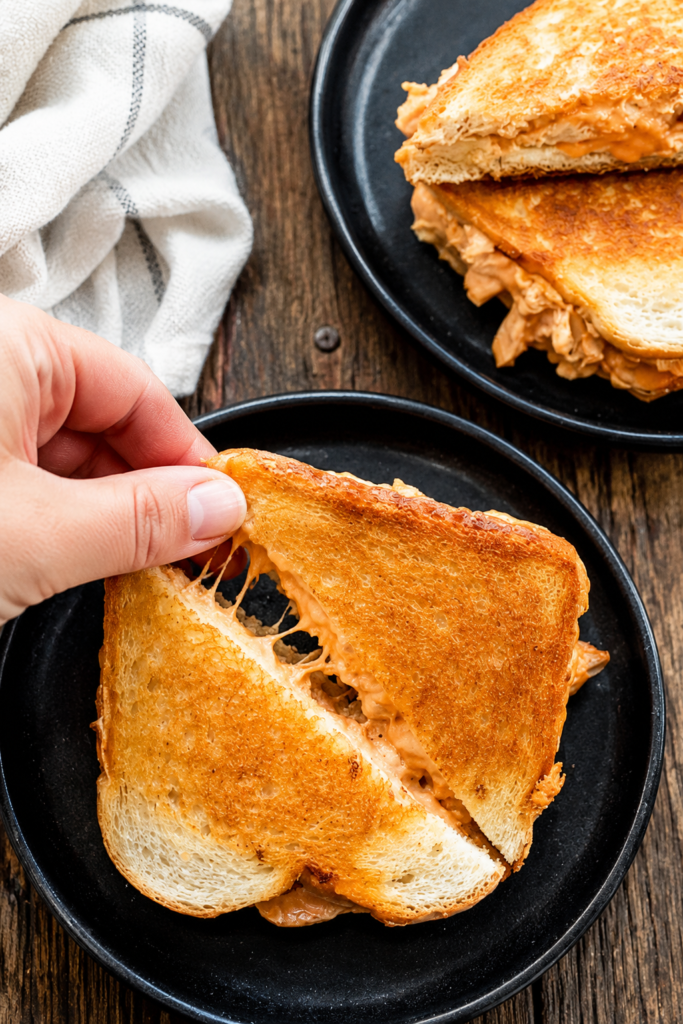 Stack of buffalo chicken grilled cheese sandwiches