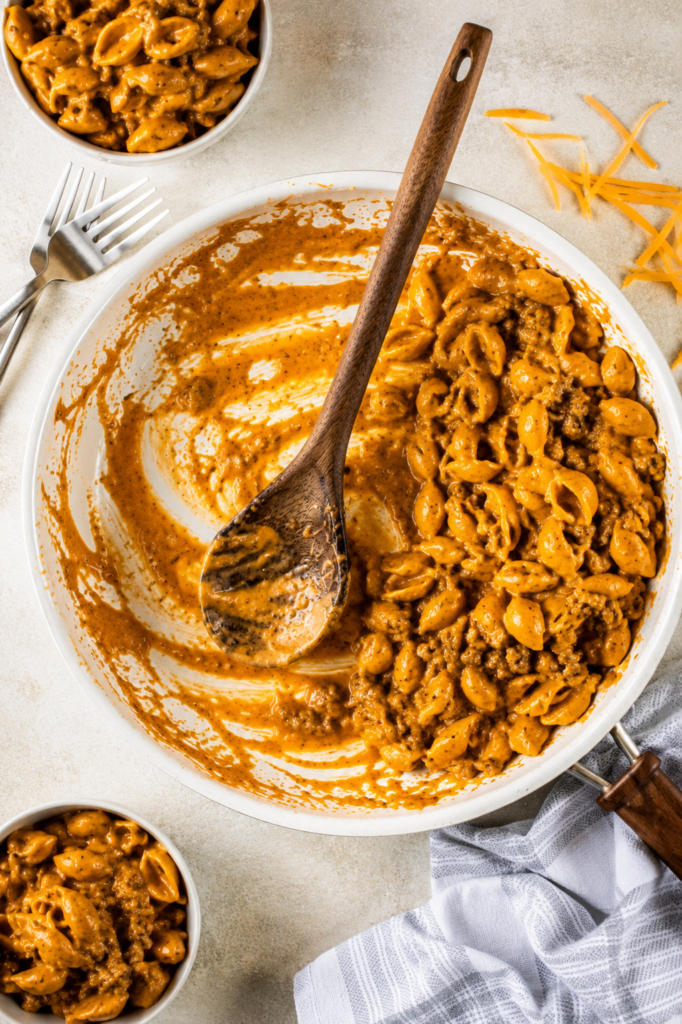 Pasta simmering in tomato sauce and broth
