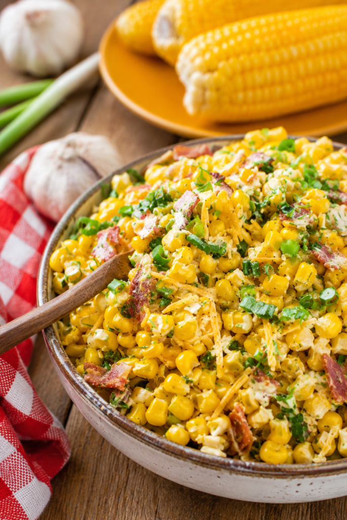 Dressing being stirred into the corn salad
