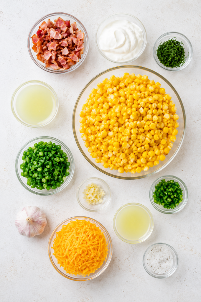 Corn, bacon, cheddar, and jalapeno combined in a bowl